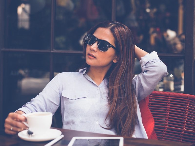 Woman sitting outside with coffee