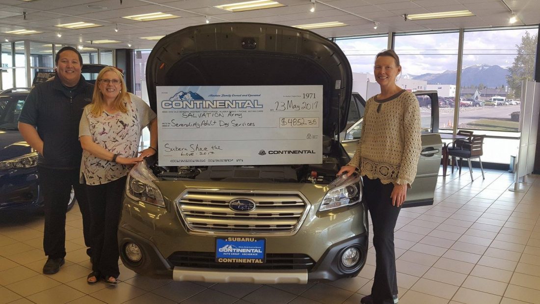 Susan Hamilton and Mike Salem of Continental Subaru present Serendipity Director Cathy Brenner with a Share the Love check.