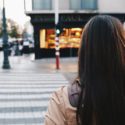 Female about to enter crosswalk on street