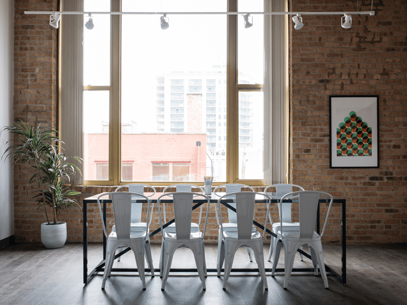 Table with chairs around it by window