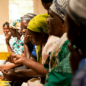 Kenyan women sitting inside