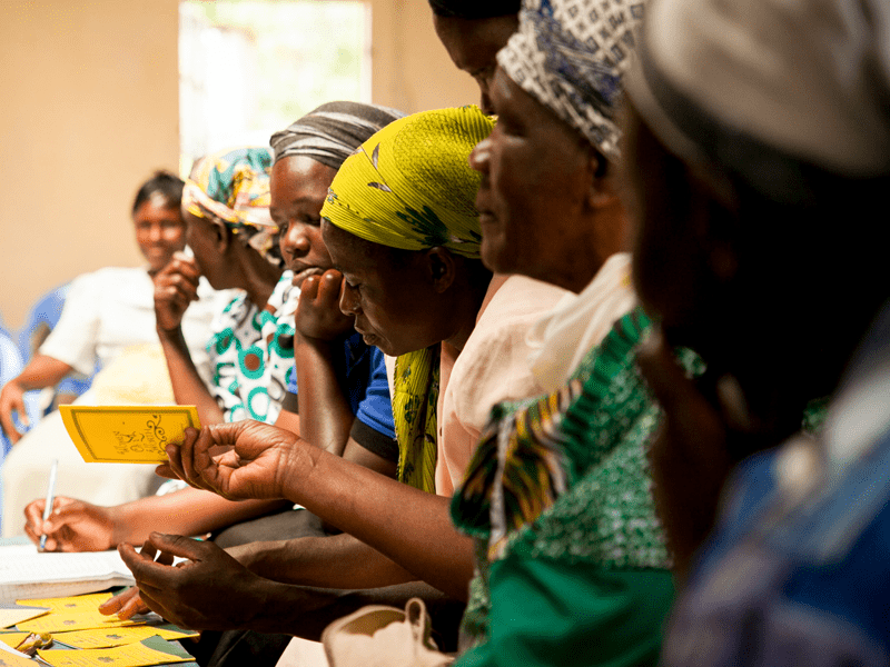 Kenyan women sitting inside