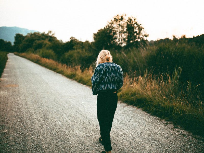 Woman walking alone outside