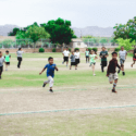 Children running on field
