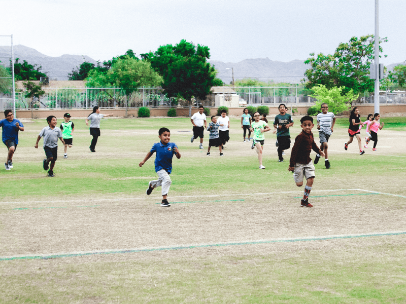 Children running on field