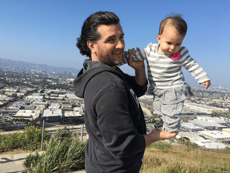 Father holding young daughter 