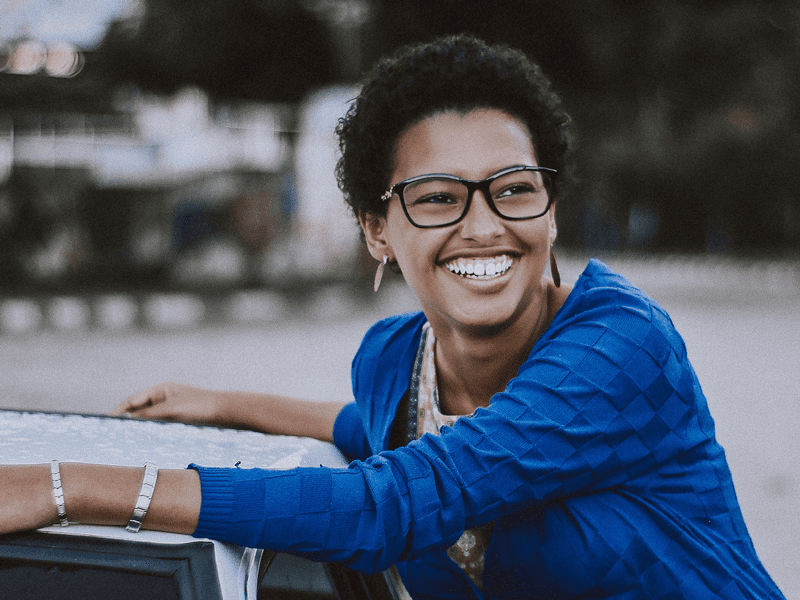 woman smiling while doing good