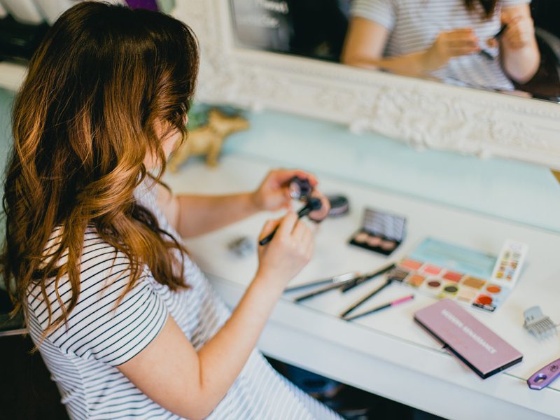 Daughter holding makeup