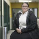 Lt. Denice Delgado sitting down and smiling