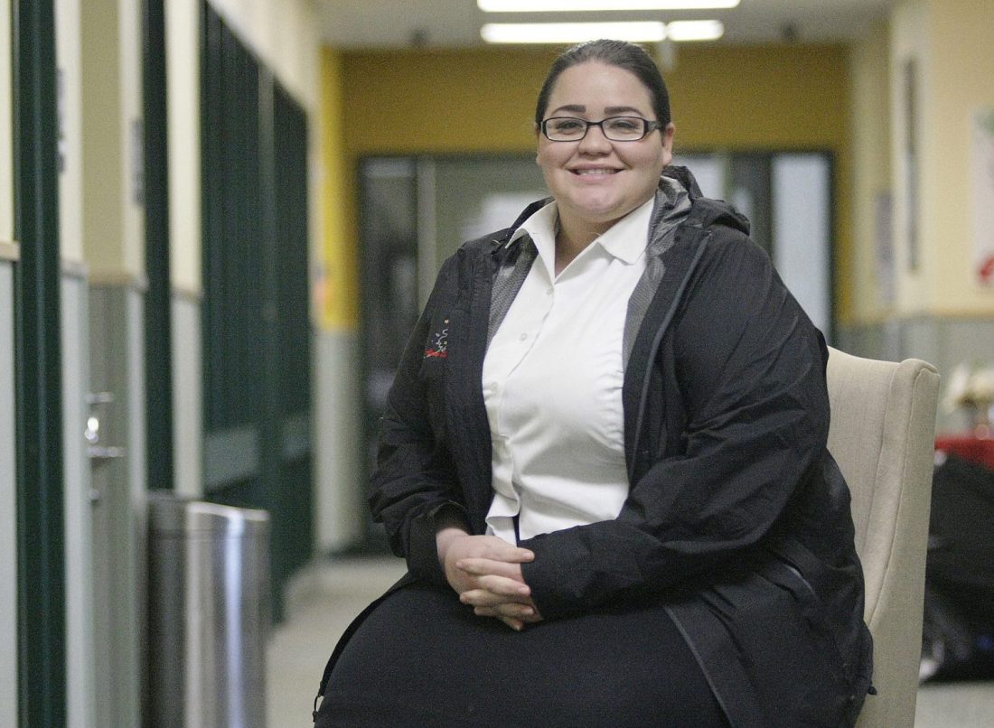 Lt. Denice Delgado sitting down and smiling