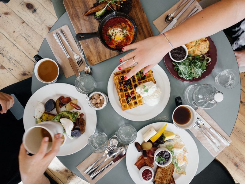 group eating breakfast at table