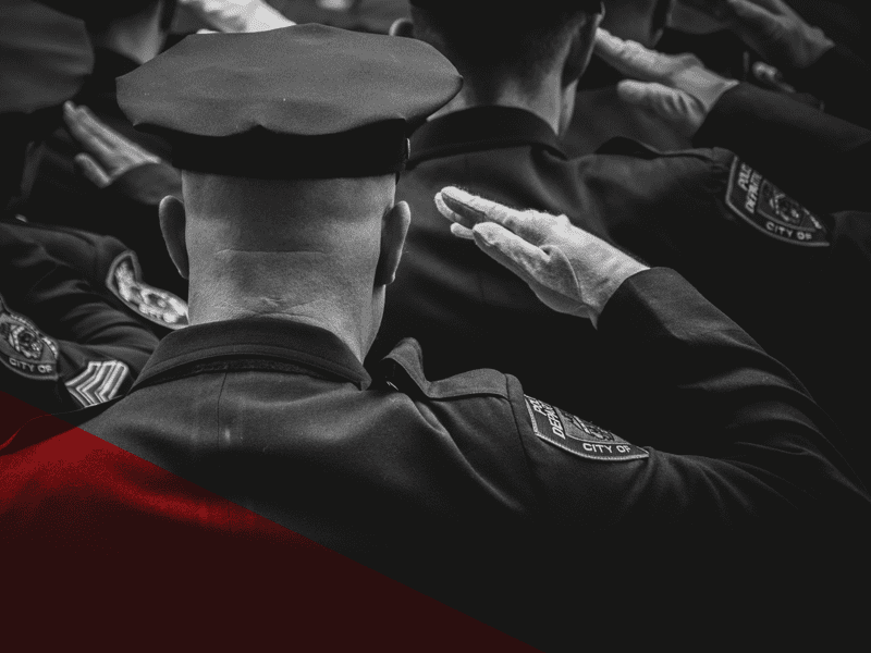 Police Officer saluting from behind