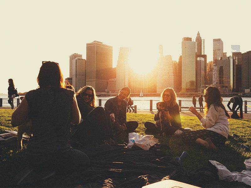 group sitting together in city park