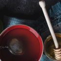 red cup and honey dipper