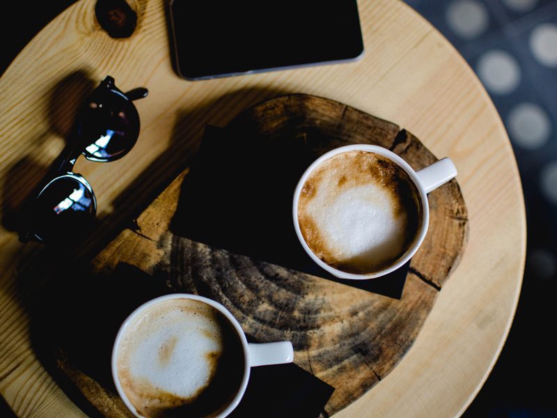 Two cups of coffee on table