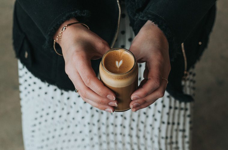 hands holding candle