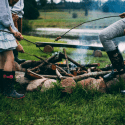 two people making campfire
