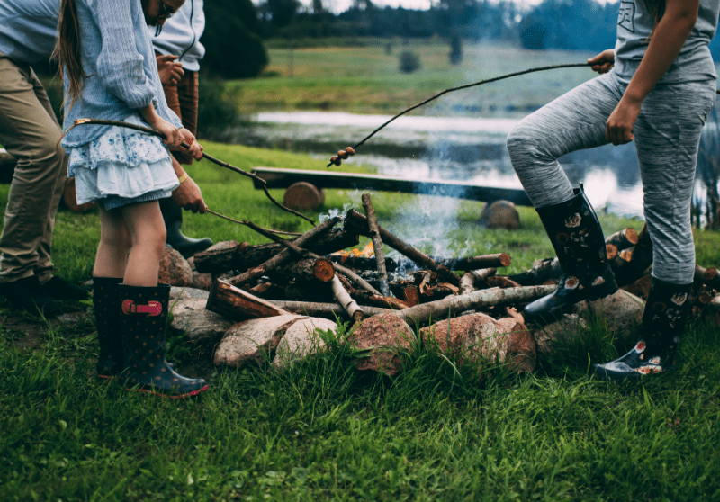 two people making campfire