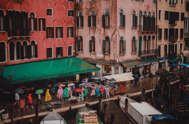 View of street with people wearing ponchos