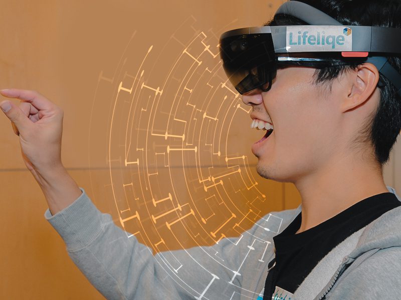 Profile of youth wearing augmented reality goggles