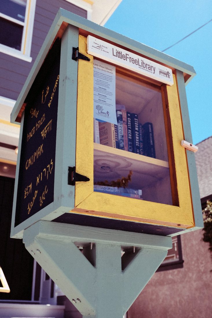 free library stand with books inside