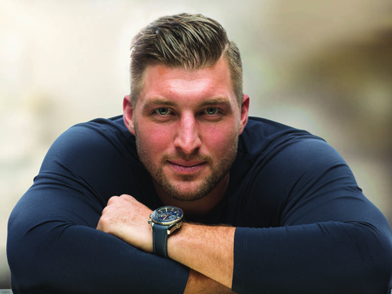 Tim Tebow with arms crossed