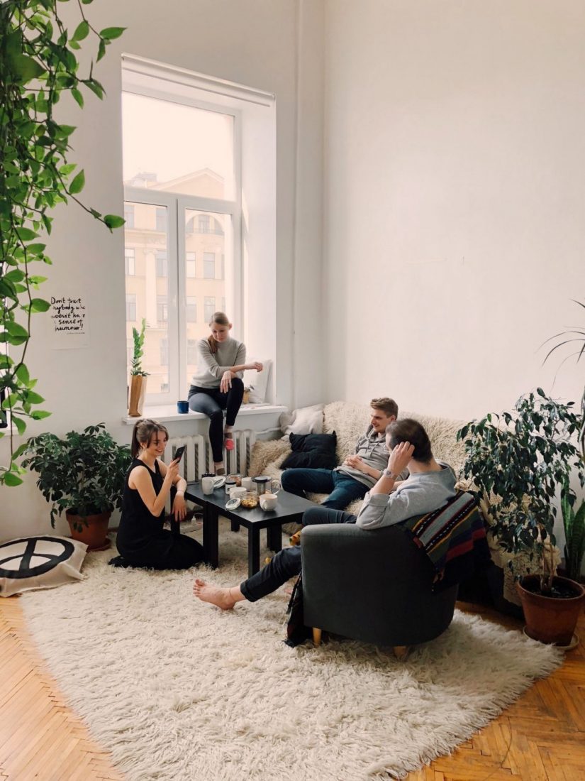 group of friends sitting in a room