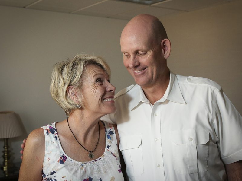 Man and woman smiling at each other