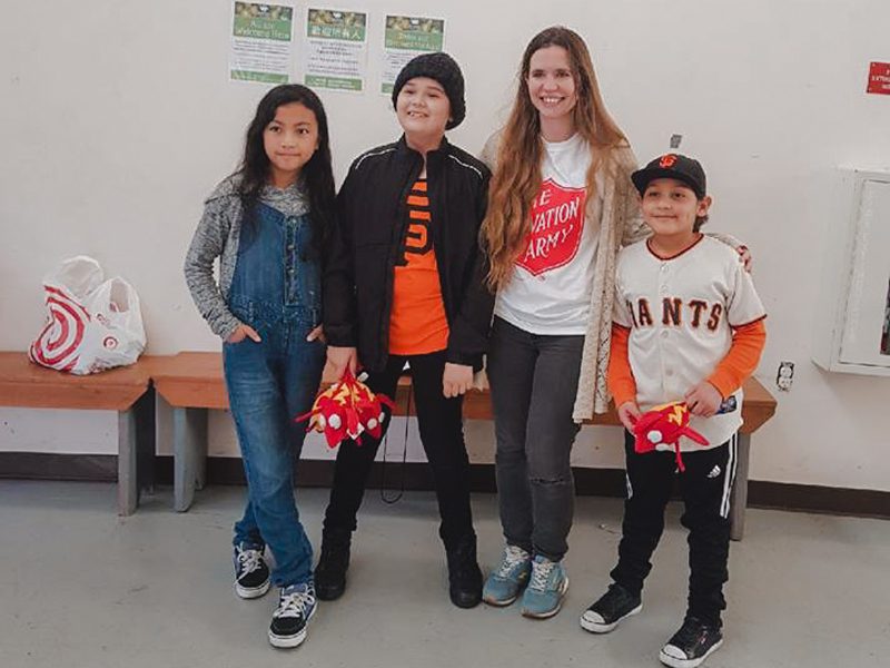 Elizabeth Veras Holland with children smiling