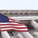 American Flag waving in front of columns