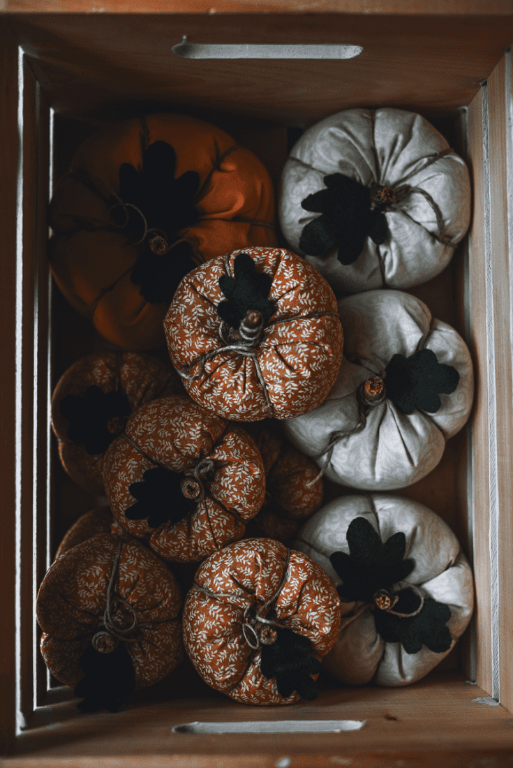 sewn pumpkin cushions in crate 