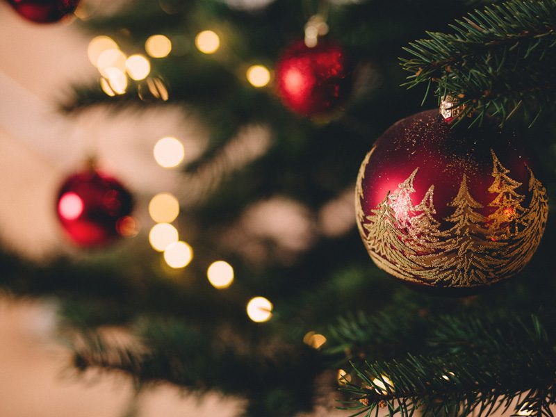 closeup of red ornaments on Christmas Tree