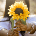 Woman holding sunflower