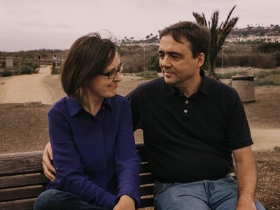 David and Diane sitting outside on bench
