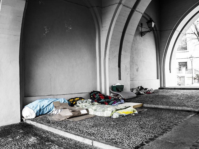 homeless man sleeping outside