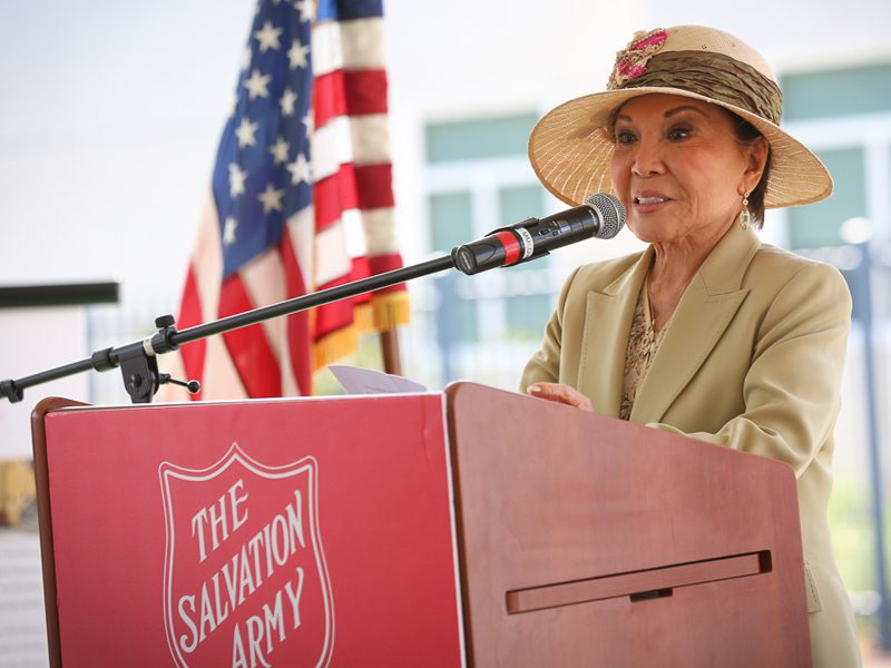 Priscilla Hunt speaking at podium