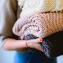A stack of blankets being held