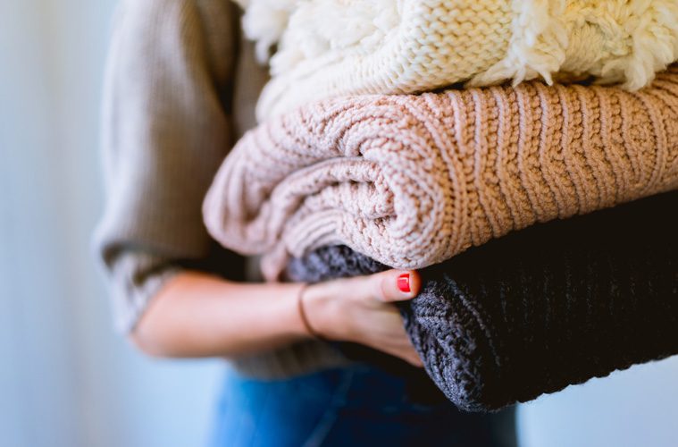 A stack of blankets being held