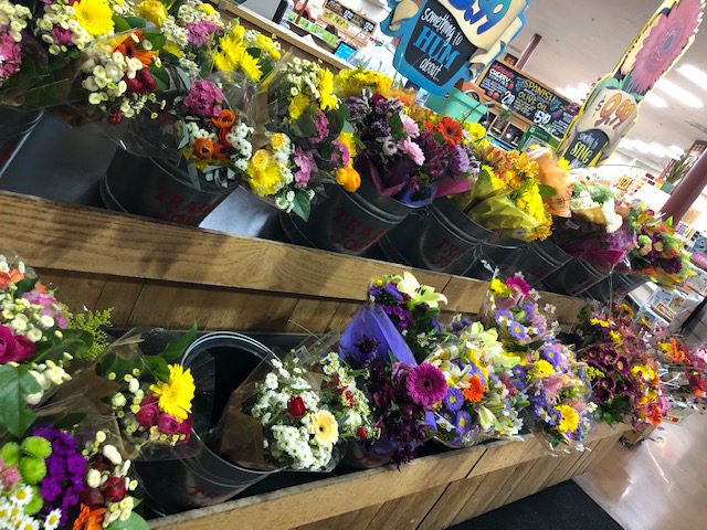 Flower Bouquets Displayed on Shelf in Store