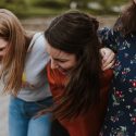 Female Friends Happy with Arms Around Each Other