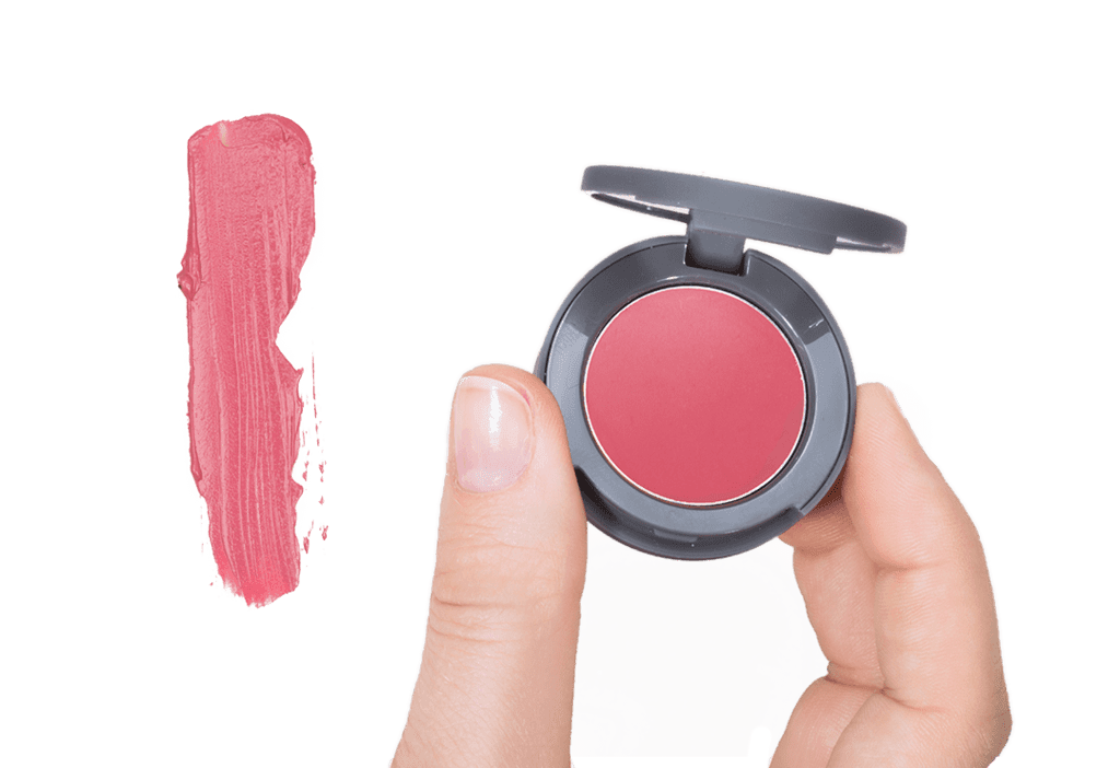 Red Stowaway Cosmetics Being Held Showing Product