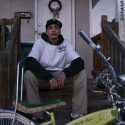 Robert Wallace Sitting on Porch with Custom Built Bike
