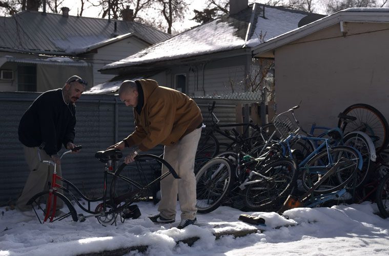 Robert Wallace and Friend Examining Bikes in Snow