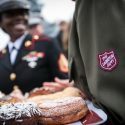 Salvation Army Soldiers Holding Donuts