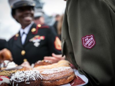 Salvation Army Soldiers Holding Donuts