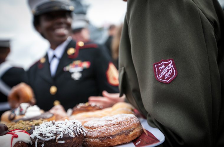 Salvation Army Soldiers Holding Donuts