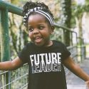 Smiling Child Walking Outside on Bridge