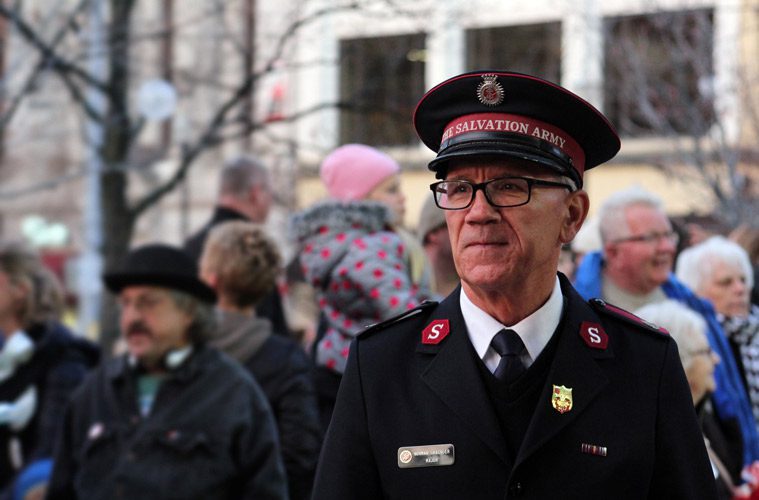 Man in Salvation Army Uniform with Crowd