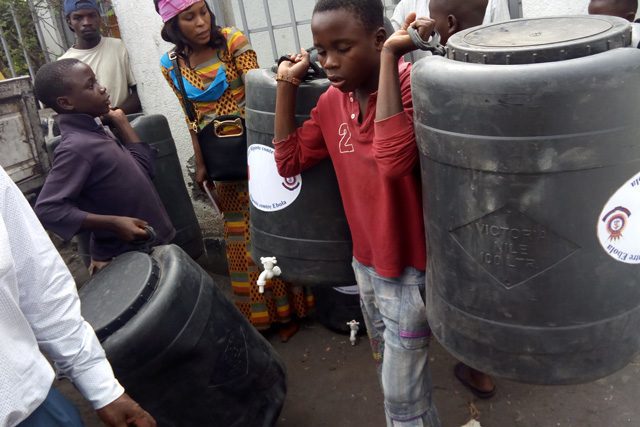 Child holding buckets