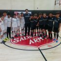Eric Riddle Standing with Kids During Salvation Army Sports League